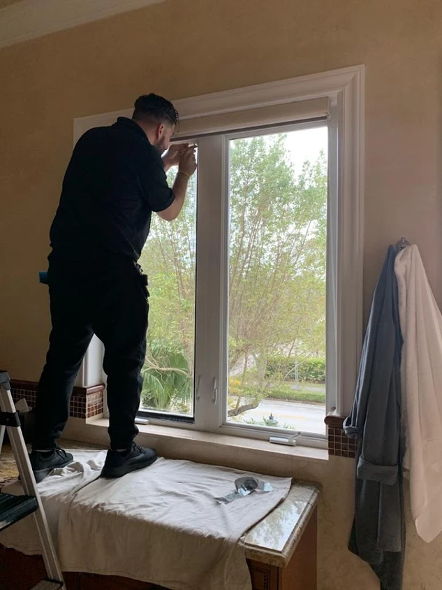 Man Working On Window Film